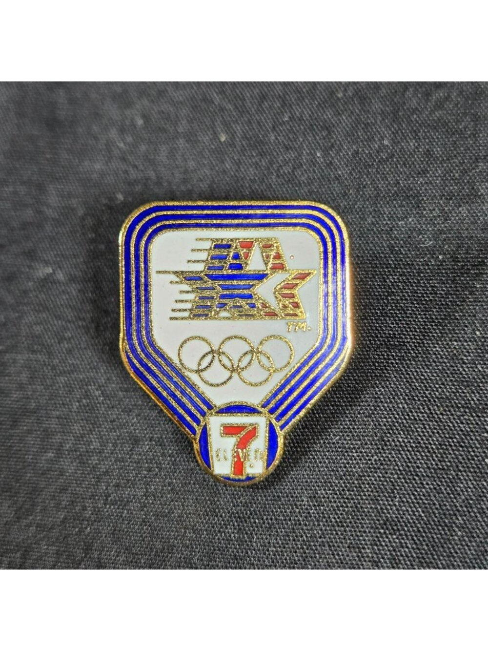 1984 Los Angeles Olympics 7-Eleven Sponsor Enamel Pin Gold Tone Collectible